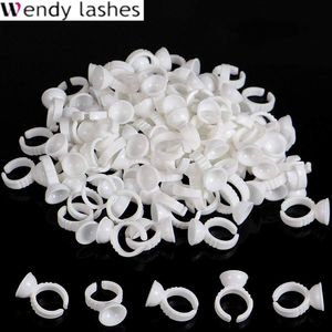 Pinsel 100pcs/Beutelkleber Ringe Wimpernverlängerung versorgt Make -up -Werkzeug Einweg -Kleber -Kleberhalter Wimpernerweiterung für Profi