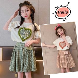 Set di abbigliamento Nuovi vestiti per ragazze estive Camicia a maniche corte per bambina e gonna adatta per bambini Abiti per bambini scozzesi per bambini 2 pezzi