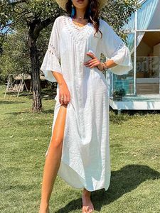 Kvinnors badkläder 2023 Kvinnors baddräkt täcker ärmen Kaftan Beach Tunic Dress Robe Sexig ihålig utdragen vit bomullspareo Sommarstrandkläder