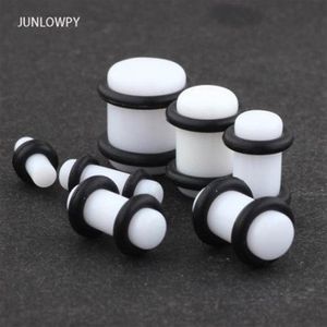 Acrílico branco preto crescer no escuro brinco medidor expansor maca plug e túnel piercing 100pcs238h