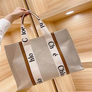 Topp kvinnliga handväskor Woody Tote Shopping Bag Handväska Hög kvalitet Canvas Fashion Linen Stora strandpåsar Luxur Designer Travel Cross229k