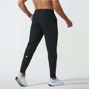 LU LU L Jogger Длинные брюки Спортивная одежда для йоги Быстросохнущие спортивные штаны с карманами на шнурке Спортивные штаны Брюки Мужские повседневные брюки для фитнеса с эластичной резинкой на талии Fvgtb