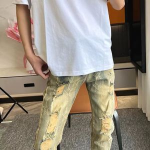 Spring and autumn new vintage printed jeans men elastic slim straight leg Europe and the United States personality yellow mud hole casual pants 26