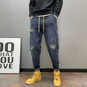 Hipsterhålmatta tiggar jeans män vår och faller nya avslappnade små fötter långa byxor Harlan Daddy Pants 32