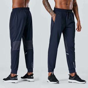 Produção exclusiva transfronteiriça de corrida masculina, fitness ao ar livre, calças de secagem rápida, leggings casuais soltas e respiráveis, UA