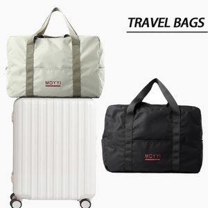 Duffel Bags Sport Travel Bag stora kapacitet Oxford Waterproof Bag Fashion Helg Handväska Singel-axel Kvinnors Duffel Bag Suitcase 231207