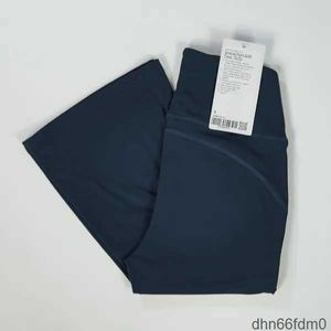 LL Pantaloni svasati da yoga Pantaloni lunghi scanalati da donna a vita alta Slim Fit Pantaloni a zampa d'elefante Mostra gambe Rete fitness Tinta unita T32C