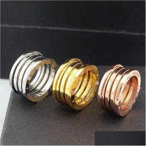 Anelli a fascia Design di lusso Anello in acciaio al titanio Sier Oro rosa Moda per gli amanti Coppia in ceramica bianca nera Regalo Consegna a goccia Gioielli Dhikx