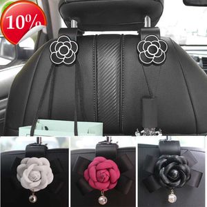 Novo universal camélia flor assento de carro volta ganchos portátil pendurado gancho de armazenamento para saco bolsa pano decoração acessórios do carro meninas