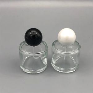 Partihandel 50 ml glas parfymflaskan cylindrisk högkvalitativ parfymflaska rund mössa kosmetiska sprayflaskor