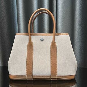 Totes Bag Gardens Party Handbag Canvas Borsa di grande capacità Totes Garden Party Borse Vera pelle 7a Handswen Versione in tela ad alta edizione con una dimensione di 30 20 cm