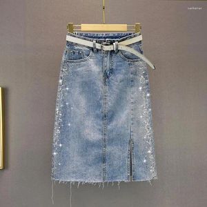 Kjolar kvinnor borrning denim kjol 2024 sommar hög midja sidospel kort wrap höft jean s-3xl mode kvinnlig smal passform