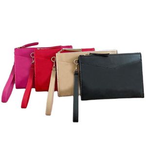 Clutch Bag Womens Wristlet Bags Fashion Accessoires Nyckelpåse Designer Dragkunnig myntväska handväska utomhuskopplingar Wallet257w