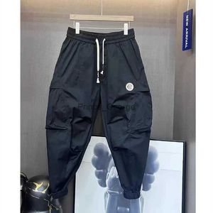 Pantaloni da uomo Abbigliamento uomo 2023 Pantaloni da uomo nuovi Tuta Primavera Estate Pantaloni casual elastici da uomo Baggy All-match Nove punti Pantaloni cargo HommeL2402