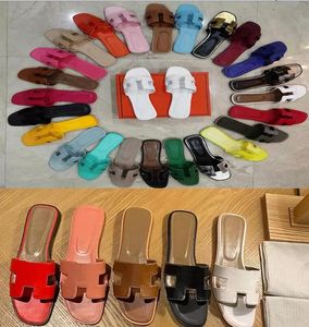 Kvinnors designer tofflor lichee mönster sommaren platt botten bokstav sandal tofflare flip flops lyxig platt solid colorwomen utomhus strand sandaler