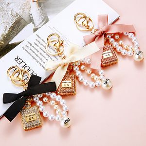 Cell Phone Straps & Charm Pearl Perfume Bottle Bowknot Car Key Chain Cute Creative HandBag Pendant Ring Diamond Inlaid Women Accessories Gift 2023