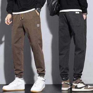 Męskie spodnie M-5xl jesienne zima męskie bawełniane spodnie do joggera moda streetwear elastyczna talia harajuku spusty spodnie marki ubrania czarne szary 231214