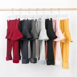 Byxor med solida färgflickor byxor barn leggings 2-10 y barn kläder höst bomull leggings varm baby flicka kjolbyxor hög kvalitet 231215