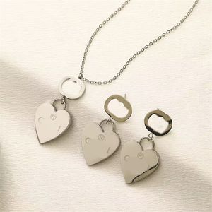 Collana da uomo comune con doppia lettera orecchini a bottone da donna collana di design in metallo liscio gioielli da donna ordinario orecchino a cuore pendente romantico zb097