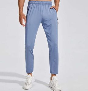 Designer LL Lemons Mens Jogger Calças Longas Esporte Yoga Outfit Quick Dry Cordão Ginásio Bolsos Sweatpants Calças Casuais Cintura Elástica Fitness 4 Cores Luli