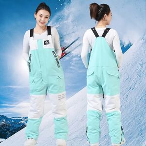 Cykelmössor masker onepiece skidbyxa för kvinnor och män vintervattentät vindtät termiska andningsbara par skidåkning snowboard jumpsuit 231215