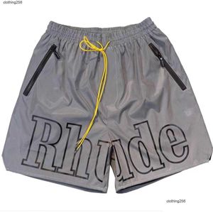 T-shirts pour hommes Rhude Mens Shorts Summer High Street Alphabet Imprimer DString réfléchissant Hip-Hop Pantalons décontractés Beach Five-Point Trendy Men Dhvas