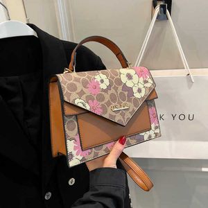 Bolsas de grife para mulheres com uma sensação de ponta de gama nova e versátil de um ombro de bolsa de crossbody Light Luxury Estilo Estilante Feminino Mochila Feminina