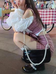 Vestidos de trabalho xadrez coreano designer duas peças conjunto feminino bandagem retro doce mini saias terno feminino fora do ombro topos moda saia 2023