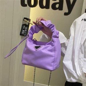 2024 New Designer women's crossbody shoulder feeling Messenger portable underarm and pop version bag