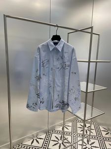 Camisa grande design de marca camisa da moda casaco graffiti todo Instagram moda moda vento neutro casais masculinos e femininos botão de lapela camisa de rua frita legal