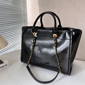 Luxury Tote Bag Womens Designer Handväska strandväska för kvinnliga tygväskor med kedja kvinnors lyxiga handväskor stora shoppingväskor axelväskor rese semester handväska