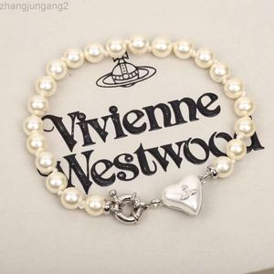 デザイナーViviene Westwoods Viviennewestwood Dowager Vivian's Trumpet Love Saturn Pearl Niche Design Peach Resin Bracelet Highバージョン