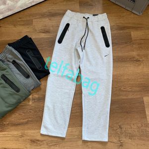 Luksusowy projektant Niki Casual Sports Pants Mężczyzn Mężczyznowy specjalne spodnie z zamkiem błyskawicznym z elastycznymi mankietami w talii ciepły bawełniany materiał