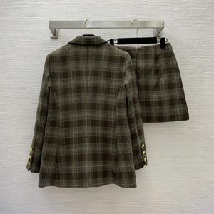 Tvådelad klänning Autumn och Winter Women's Checker Set One Button Casual Suit Coat med kedjedekorativ veckad A-line kjol G23101178