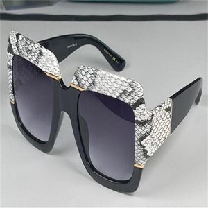 Neue Mode Frauen Design Sonnenbrille Square Snake Haut Rahmen hochwertiger beliebter großzügiger eleganter Stil 0484 UV400 Schutz G221J