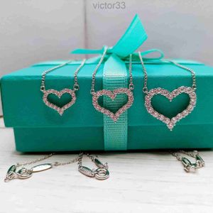 2024 Designer Tit Family S925 Sterling Silver Heart Shaped Dense Set with Full Diamond Hollow Necklace Fashion Women's Love Pendant Japanese and Korean Simple