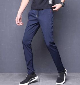 Letnie spodnie męskie rozciąganie Koreańskie swobodne spodnie Slim Fit Chino Elastyczna talia sukienka do joggera