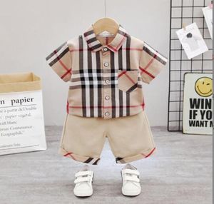 Set estivi Baby Boy Girl Tasca scozzese Camicia a maniche corte Pantaloncini scozzesi 17 anni Completo Bambini Bambini039s 2 pezzi Abbigliamento Se5769951