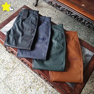 Casual Fashion Jogger Brown Green Dark Blue Black Embroidery Rhude Leather Sweatpants Män Kvinnor Högkvalitativ skarv PU PANTS 231225