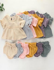 2pcs Yeni doğan bebek kız bebek giysileri setleri sevimli pamuklu yumuşak katı fırfırlar kısa kollu tişörtler üst kesim kıyafetleri kıyafetler f1210 553214440