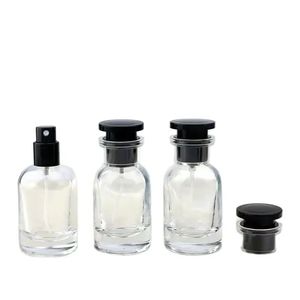Bottiglia di profumo di vetro trasparente 30 ml a forma rotonda a forma rotonda contenitori ricaricabili a forma di pacchetto di imballaggio estetico per fragranze nere bottiglie