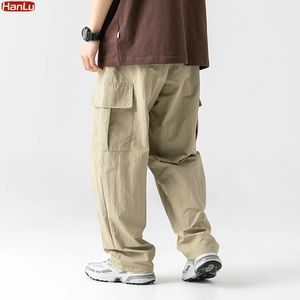 Wiosenne lato męskie spodnie ładunkowe Męskie Casual Solid Kolor proste workowate worki dla szerokopasmowych spodni mężczyźni 231227