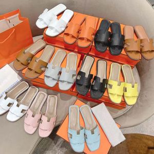 Chinelos de moda Mulheres Sandálias de designer para mulheres chinelo mens mocassins casuais sapatos ao ar livre praia slides fundo plano com fivela unissex couro genuíno Dhgate