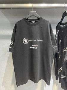 b World Food WFP Paris Band Tarwe Oren Gebroken Gaten T-shirt met schuimprint en korte mouwen