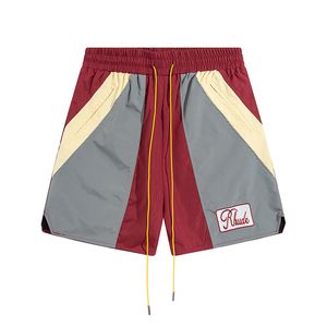 Rhude män andningsbara strand shorts män kvinnor casual mesh spår överdimensionera rhude shorts midja dragkonstruktioner gratis frakt för svarta vita shorts 910