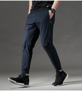 Тонкие тренировочные спортивные штаны с быстрым сухим удобными бегунами мужчины, управляющие длинными брюками, спортивные брюки, фитнес -брюки Zip Pocket1224655