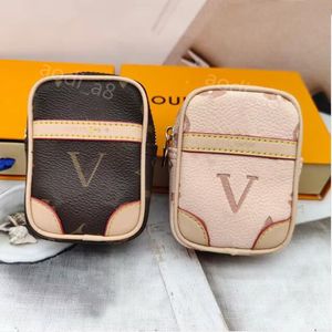 Chaveiros de designer de letras clássicas imperdíveis mini bolsa carteira de couro chaveiro de luxo pingente de bagagem chaveiro de carro chaveiro para charme homens mulheres moda fone de ouvido saco de armazenamento