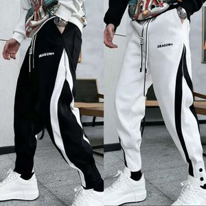 Pantaloni sportivi da jogging di moda streetwear di moda nera bianca Pantaloni da uomo di alta qualità Pantaloni sportivi casual da esterno