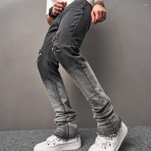 Mäns jeans 2023 Män high street rippade gradient Slim Fit Micro Fleared Pants Manliga snygga hål Stretch Denim Byxor