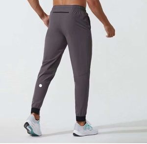 Ll Calças compridas masculinas Jogger Sport Yoga Outfit Secagem rápida Cordão Ginásio Bolsos Sweatpants Calças masculinas Casual Cintura elástica Fiess Calças de treino 3545
